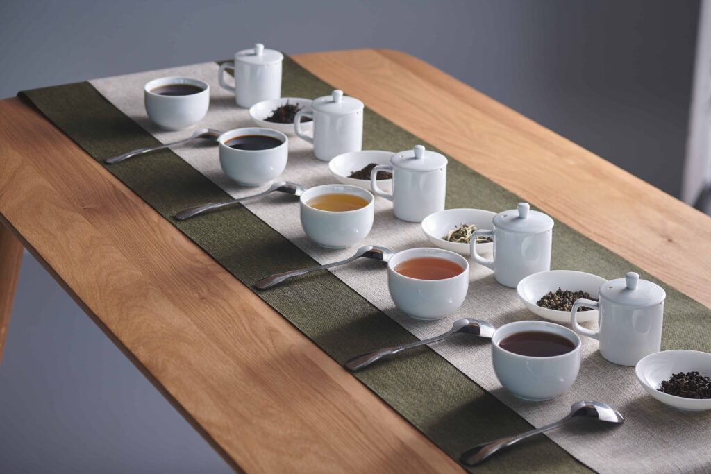 Image of cups of tea and spoons set on a table